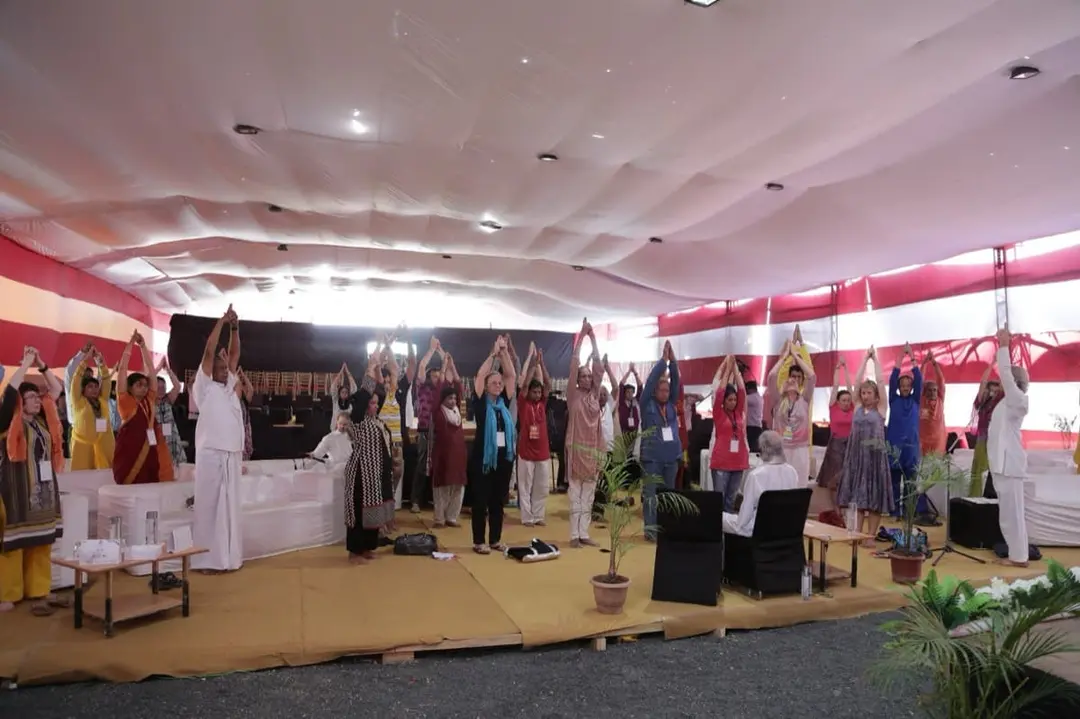 Yoga teacher training class in a hall in India